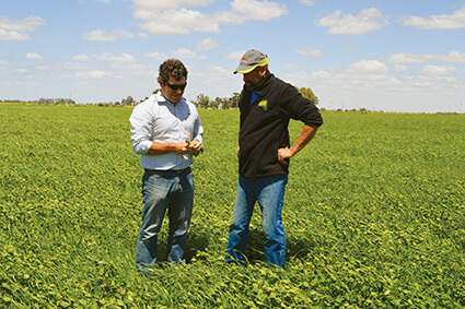 BioAg Area Manager Dan Hill with John Archard on John’s dairy farm in Victoria.