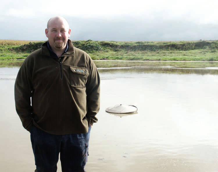 Jim Simpson, in front of the wellfunctioning effluent pond at Donovan Dairies.
