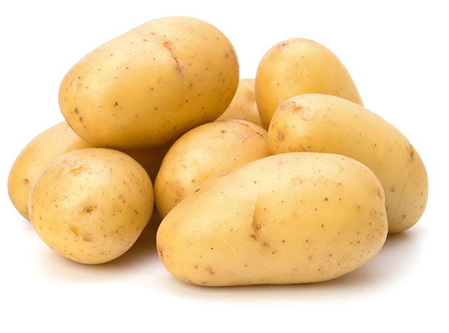 washed potatoes isolated on white